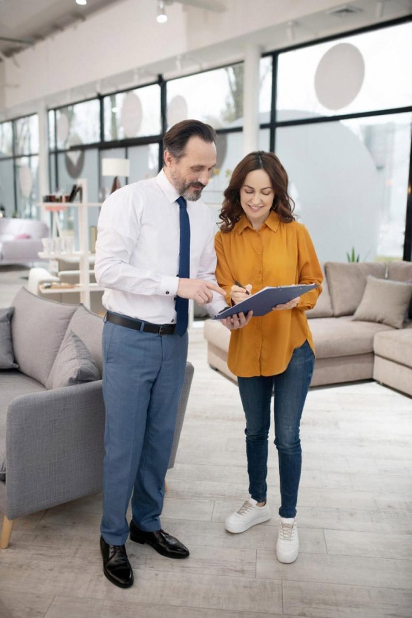 Career advisor discussing training program options with a woman in a UAE office