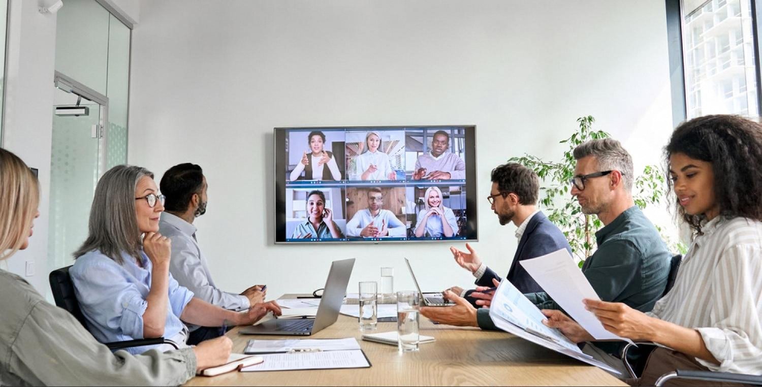 UAE business team reviewing a foreign partner during a video call